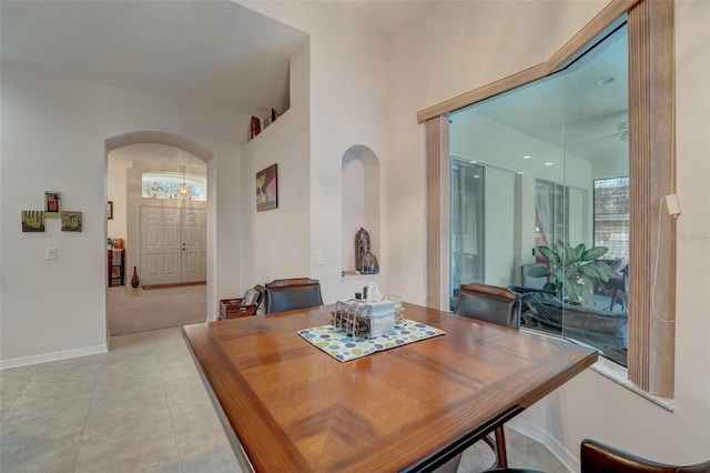 dining area with light tile patterned flooring