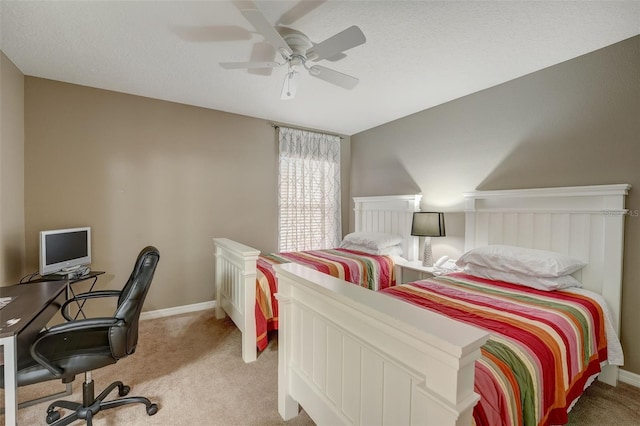 bedroom featuring a textured ceiling, carpet floors, and ceiling fan