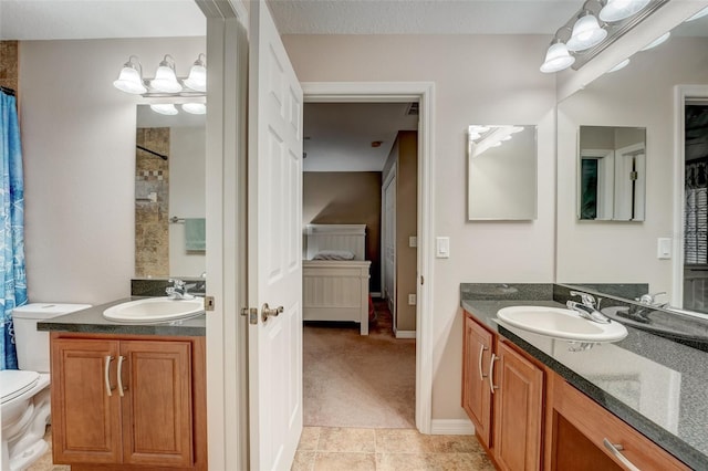 bathroom with tile patterned flooring and vanity