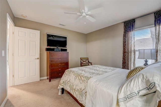 bedroom with light colored carpet and ceiling fan