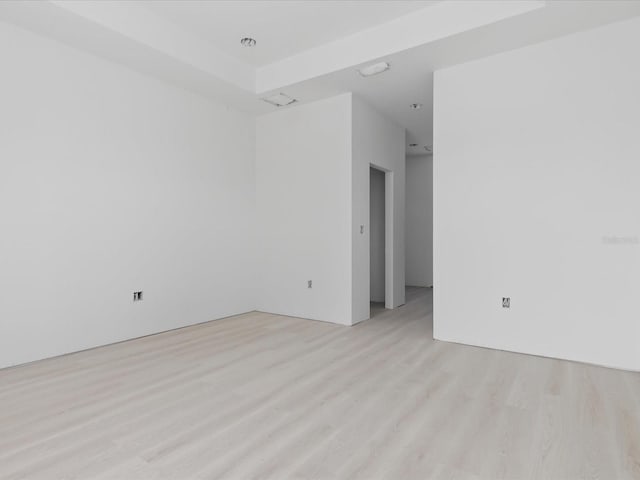 unfurnished room featuring light wood-type flooring