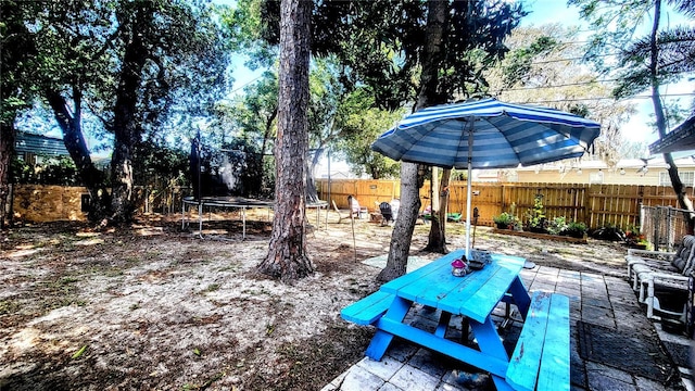 view of yard with a trampoline