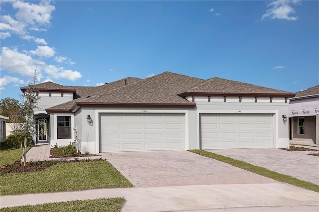 prairie-style home featuring a garage