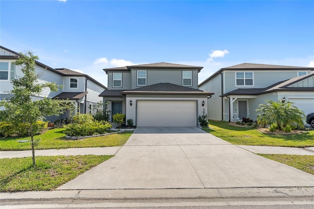 traditional home featuring a garage, driveway, and a front yard