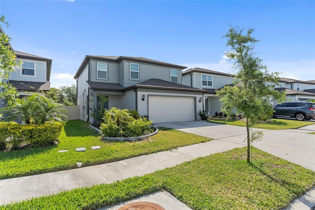 view of front property featuring a front lawn and a garage