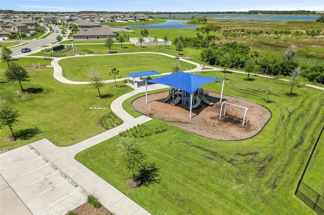 drone / aerial view featuring a water view and a residential view