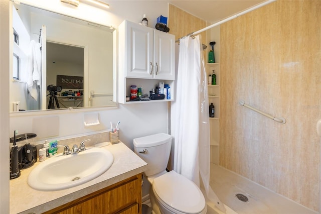 bathroom with vanity, toilet, and curtained shower