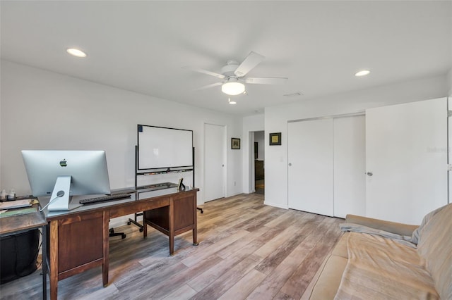 home office featuring ceiling fan and light wood-type flooring