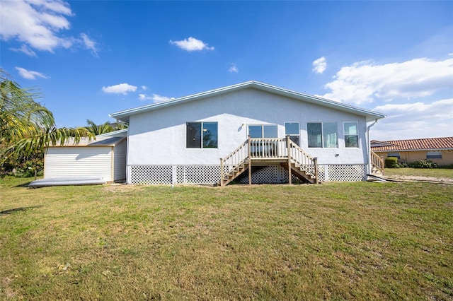 rear view of property featuring a yard