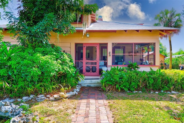 view of front of property with a sunroom