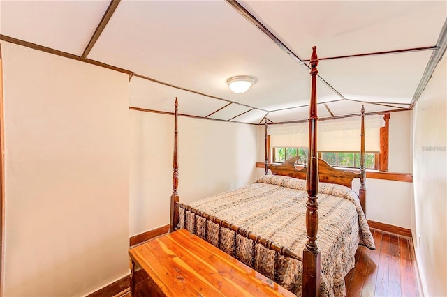 bedroom with hardwood / wood-style flooring