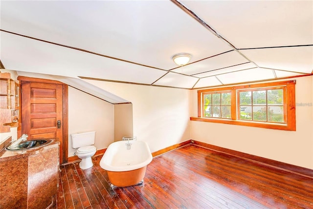 unfurnished room with sink and dark hardwood / wood-style floors