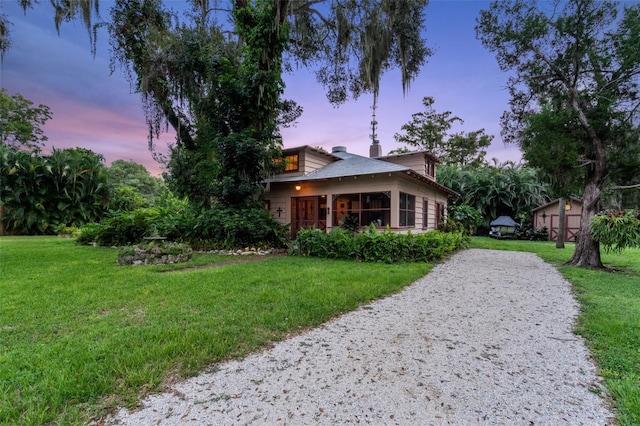 view of front of house with a yard