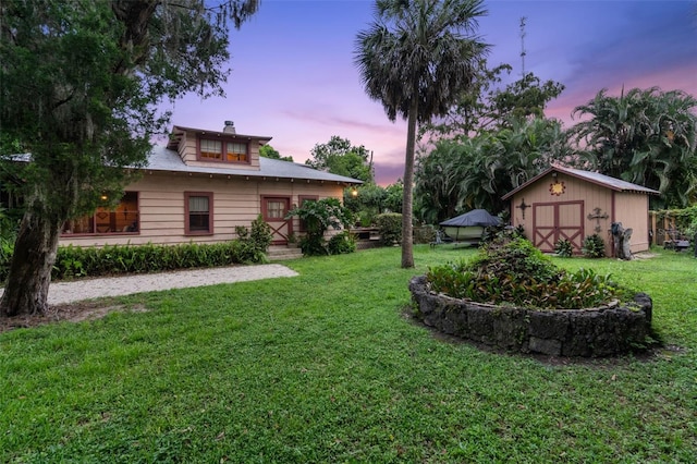 yard at dusk with a shed