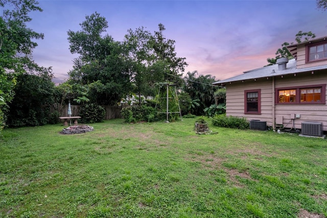 yard at dusk with cooling unit