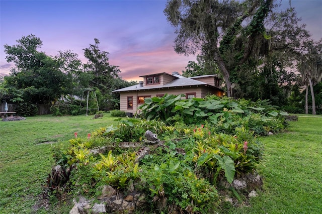 view of yard at dusk