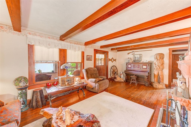 living room with wood-type flooring and beam ceiling