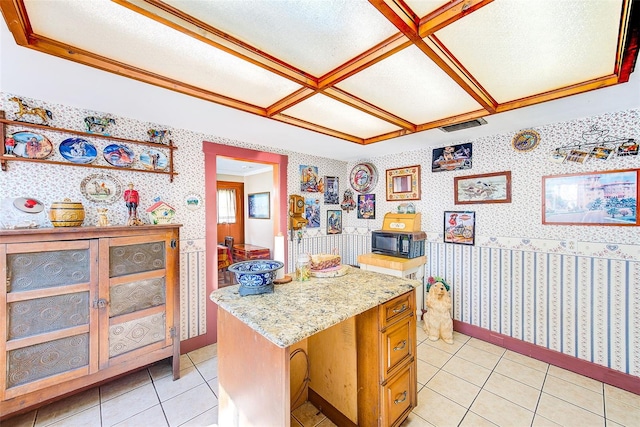 kitchen with a center island and light tile patterned flooring