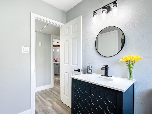 bathroom featuring vanity and hardwood / wood-style floors