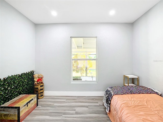 bedroom with light hardwood / wood-style flooring