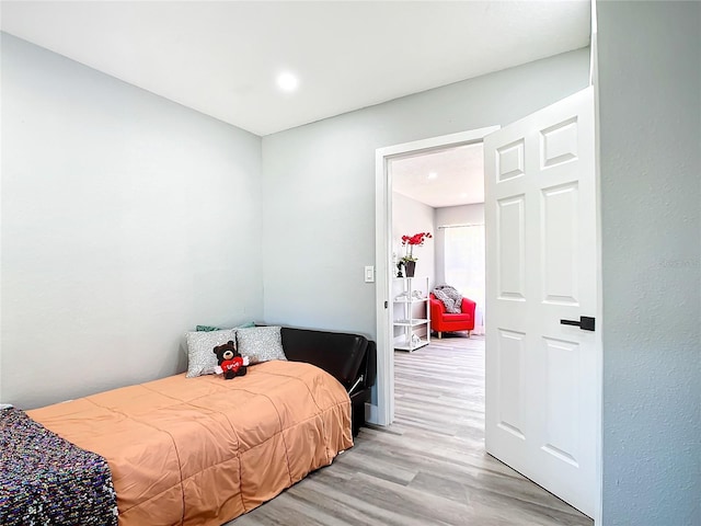 bedroom with light wood-type flooring