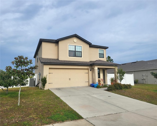 traditional home with a garage, concrete driveway, a front lawn, and central air condition unit