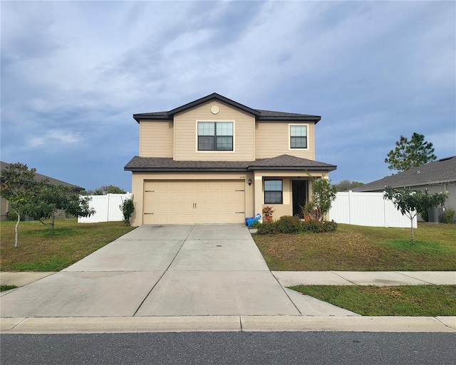 view of front property featuring a front lawn and a garage