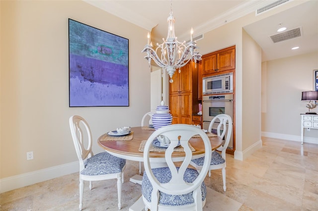 dining area with crown molding and a notable chandelier