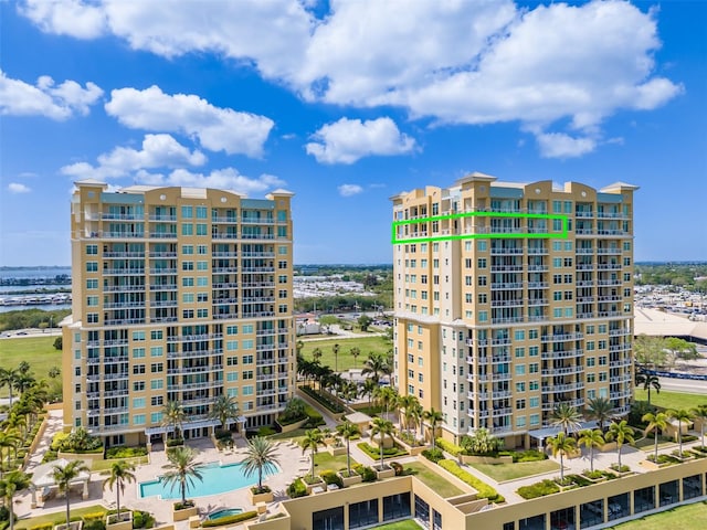 view of building exterior featuring a community pool