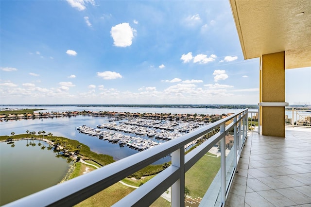 balcony featuring a water view