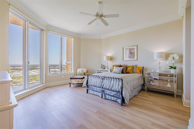 bedroom with ornamental molding, light wood-type flooring, and ceiling fan