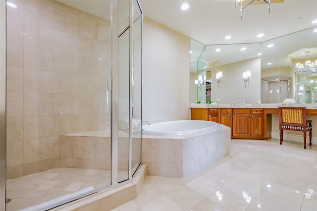 bathroom featuring vanity, shower with separate bathtub, a chandelier, and tile patterned floors