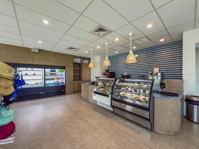 bar featuring a paneled ceiling, recessed lighting, visible vents, and wallpapered walls