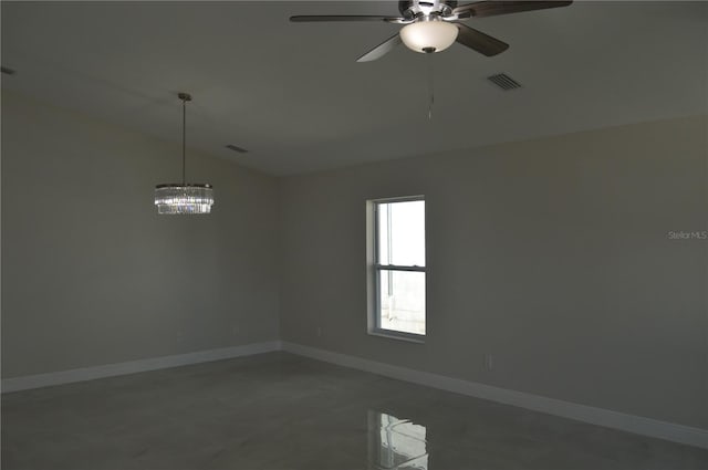 unfurnished room featuring dark tile flooring, ceiling fan with notable chandelier, and vaulted ceiling