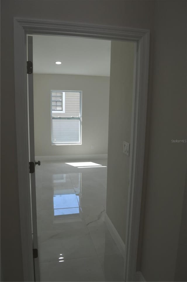 empty room with light tile flooring