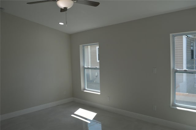 empty room featuring light tile floors and ceiling fan