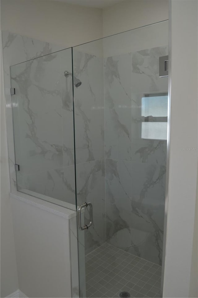 bathroom with an enclosed shower