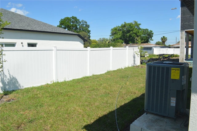 view of yard with central air condition unit