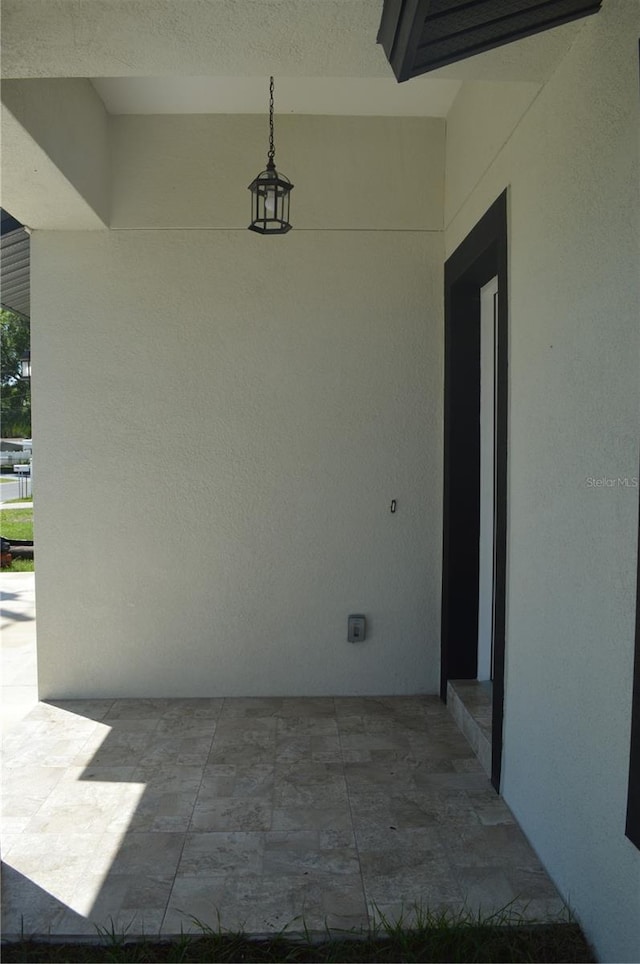 doorway to property featuring a patio area