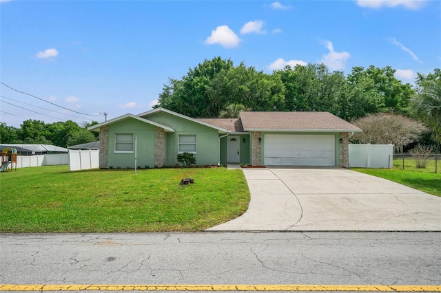 view of front of house featuring a front yard and a garage