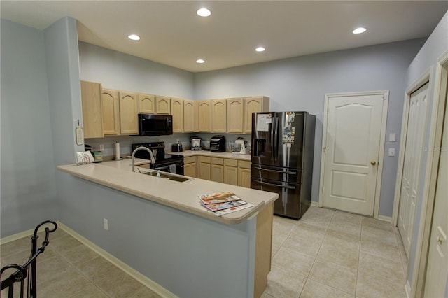 kitchen with electric range oven, refrigerator with ice dispenser, light tile floors, and kitchen peninsula