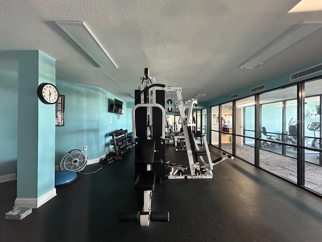 gym with a textured ceiling