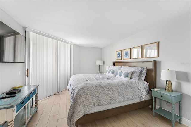 bedroom with wood tiled floor