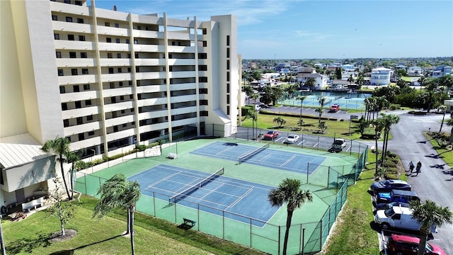 view of sport court featuring fence