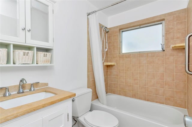 full bathroom with toilet, shower / bathtub combination with curtain, and vanity