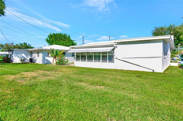 back of house with a yard