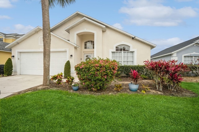 view of front of house with a front lawn and a garage