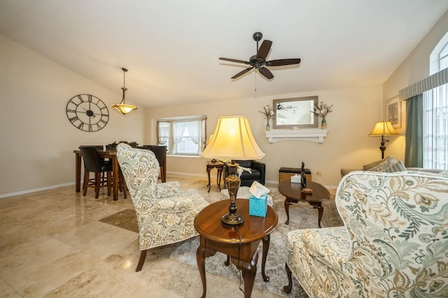 living room featuring vaulted ceiling, ceiling fan, and light tile flooring