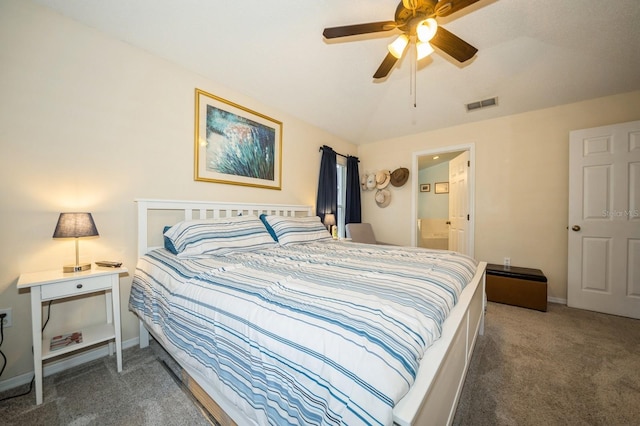 carpeted bedroom with lofted ceiling, ensuite bathroom, and ceiling fan