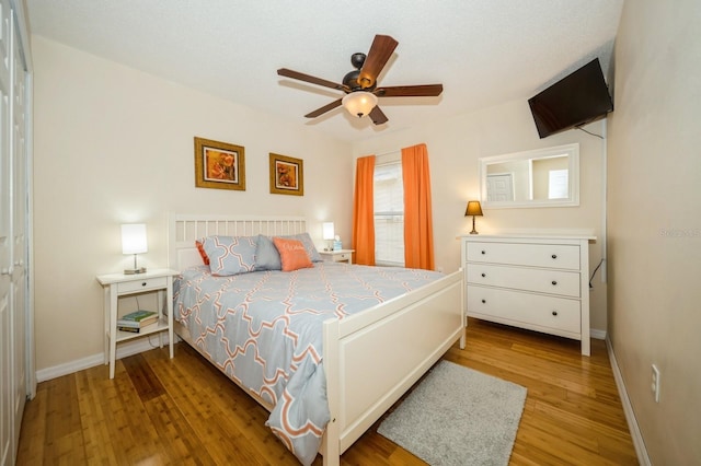 bedroom featuring ceiling fan and light hardwood / wood-style flooring